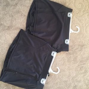 2 black golf skirts